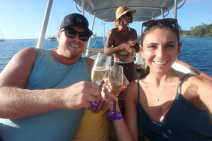 a person drinking water from a wine glass posing for the camera